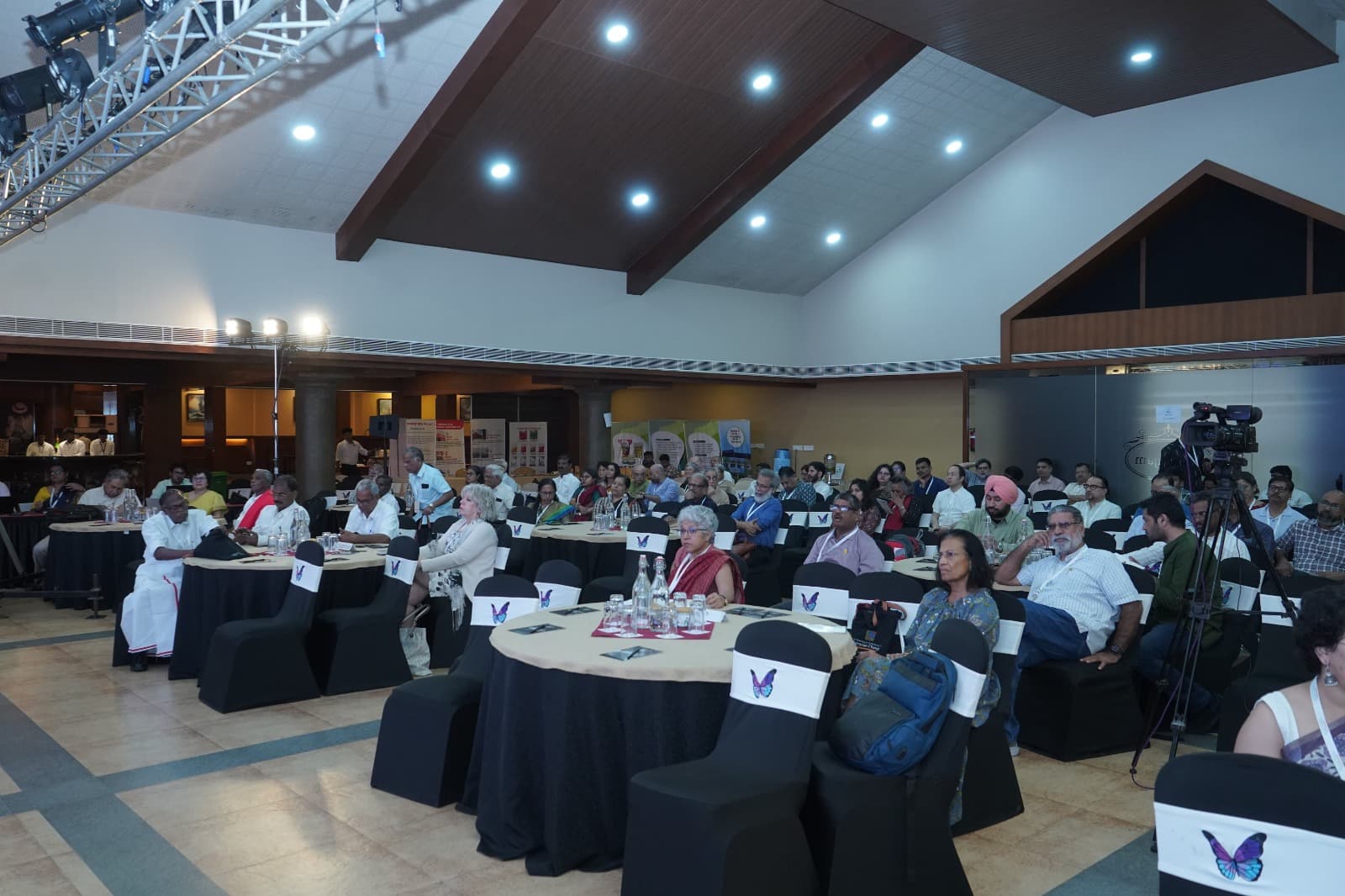 Delegates seated in discussion at a conference session